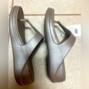 Brand new crocs, flip-flops, women’s size 9 wide